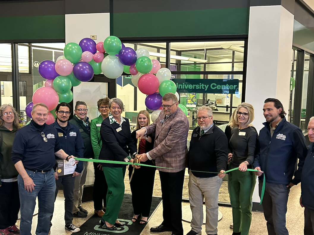 Staff, students and administrators from Southeast and Winona State University gather for the official ribbon cutting to open the new University Center at Southeast's Winona campus.